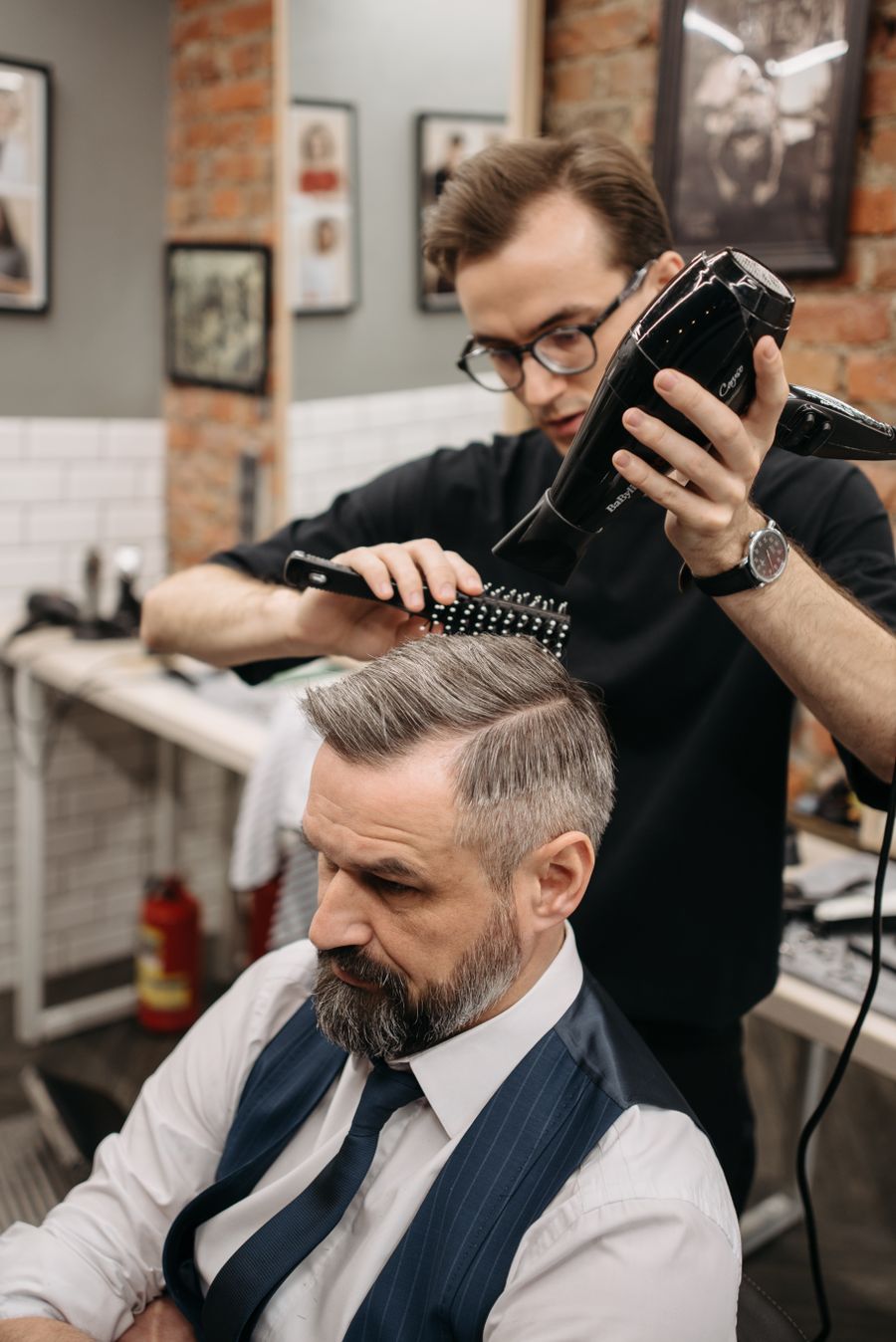 Barber styling a man's hair